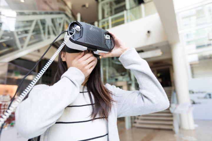 Woman Trying on Virtual Reality Device